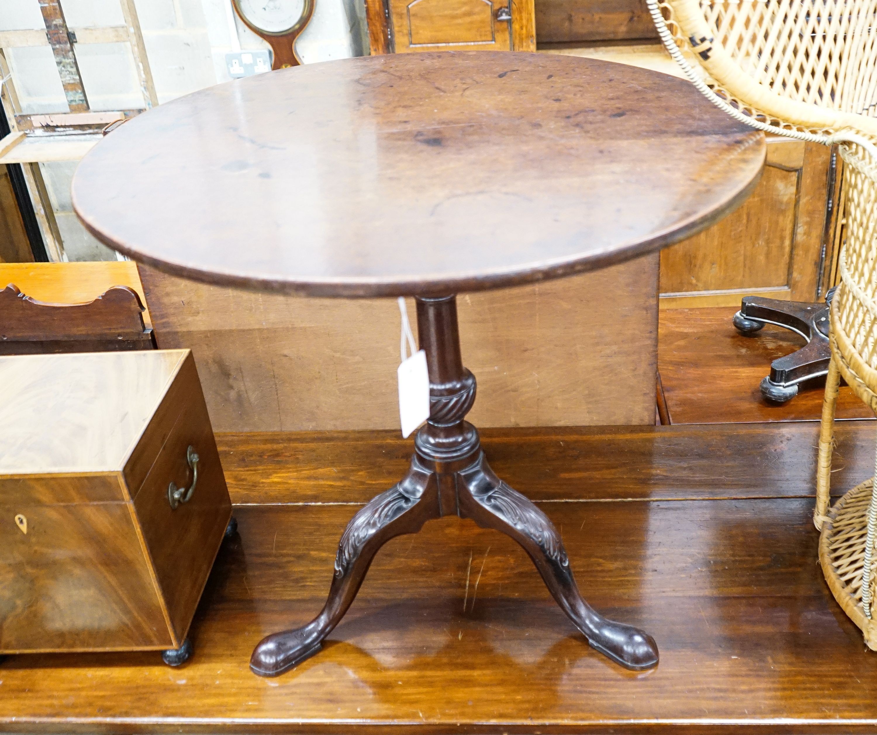 A George III carved mahogany circular birdcage tilt top tripod tea table, diameter 77cm, height 71cm